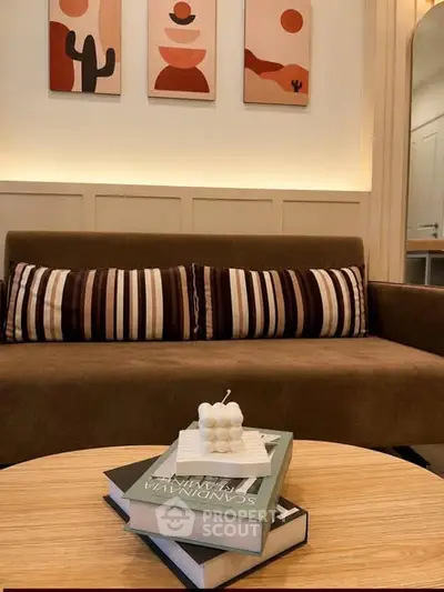 Stylish living room with modern decor and cozy seating area, perfect for relaxation.