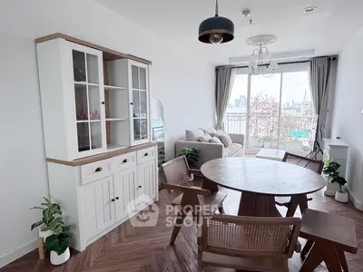 Charming living room with city view, elegant furniture, and natural light.