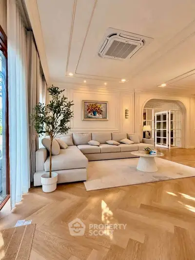 Luxurious living room with elegant decor and spacious seating area, perfect for relaxation and entertainment.