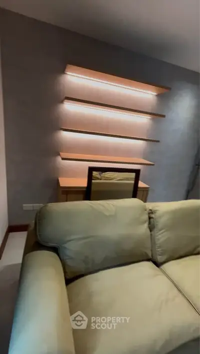 Modern living room with stylish shelves and comfortable sofa