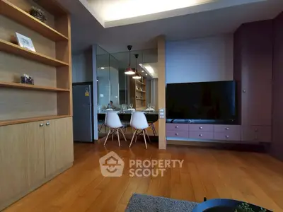 Modern living room with wooden flooring and sleek furniture design