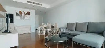 Spacious living room with modern furniture and elegant decor in a stylish apartment.