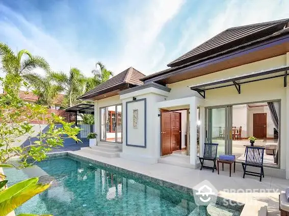 Luxurious villa with private pool and tropical garden, perfect for serene living.