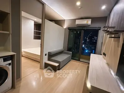 Modern apartment interior with city view, featuring sleek design and cozy living space.