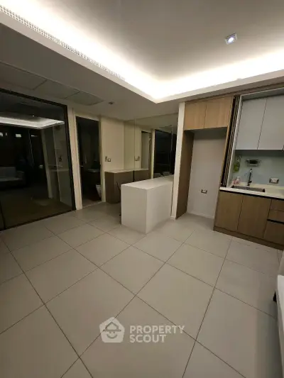 Modern kitchen with sleek cabinetry and open layout in a contemporary apartment.