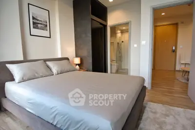 Modern bedroom with ensuite bathroom in stylish apartment