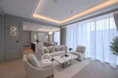 Luxurious modern living room with elegant decor and large windows offering abundant natural light.