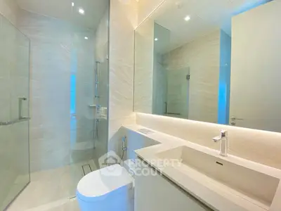 Luxurious modern bathroom with sleek design and glass shower enclosure