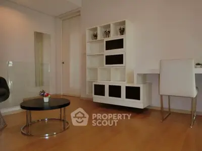 Modern living room with sleek furniture and wooden flooring