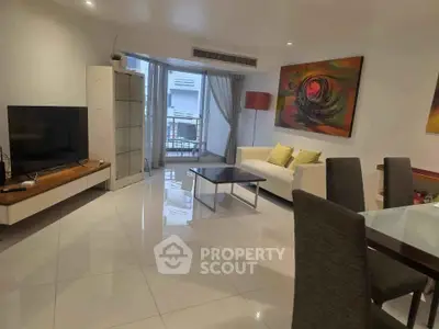 Spacious modern living room with sleek furniture and vibrant artwork, perfect for stylish urban living.