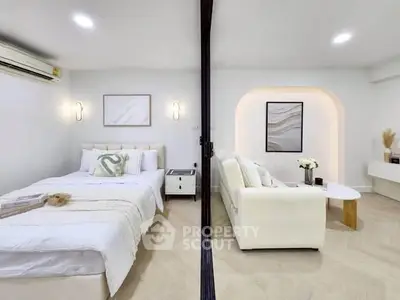 Modern studio apartment with cozy bedroom and stylish living area