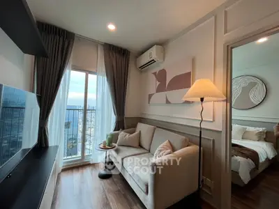 Chic living room with city view, modern decor, and cozy ambiance.