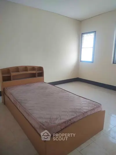 Spacious bedroom with natural light and minimalist design