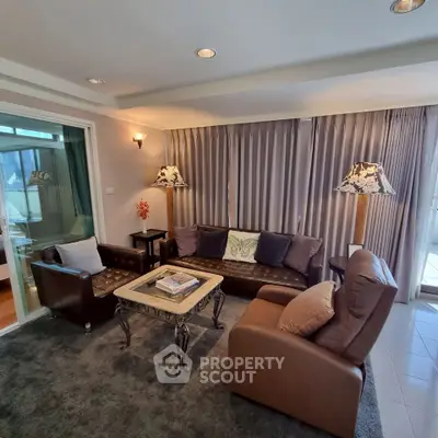 Elegant living room with leather sofas and stylish decor in a modern apartment