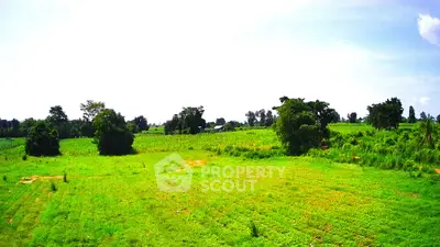 Expansive green land perfect for development with scenic views and lush surroundings.
