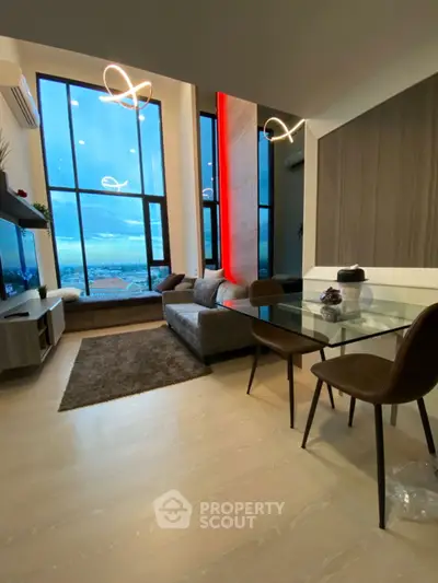 Modern living room with floor-to-ceiling windows and stylish decor