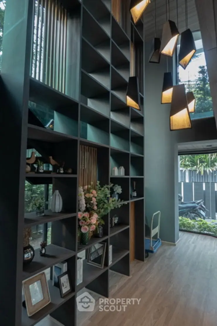 Stunning modern living room with high ceilings and elegant shelving