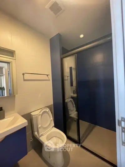 Modern bathroom with sleek shower and contemporary fixtures