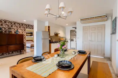 Charming open-layout dining area with modern kitchen and cozy decor