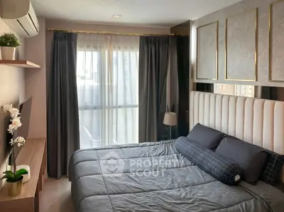 Modern bedroom with elegant decor, large window, and stylish furnishings in a luxurious apartment.