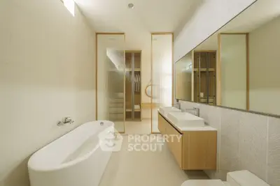 Luxurious modern bathroom with elegant bathtub and dual sinks