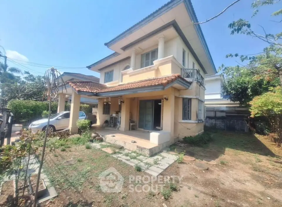 Charming two-story house with spacious garden and carport in a serene neighborhood.