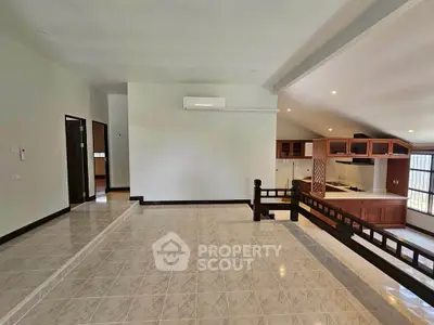 Spacious open-plan living area with modern kitchen and elevated design