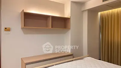 Modern bedroom with minimalist design and built-in shelving