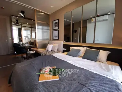 Modern bedroom with stylish decor and cozy ambiance in a contemporary apartment.