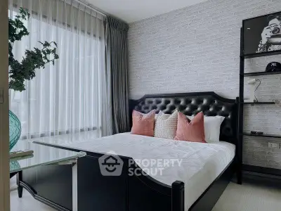 Stylish bedroom with modern decor and large window for natural light