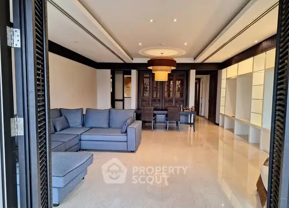 Spacious modern living room with elegant decor and large sectional sofa