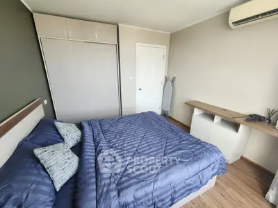 Cozy bedroom with modern decor and air conditioning in a stylish apartment.