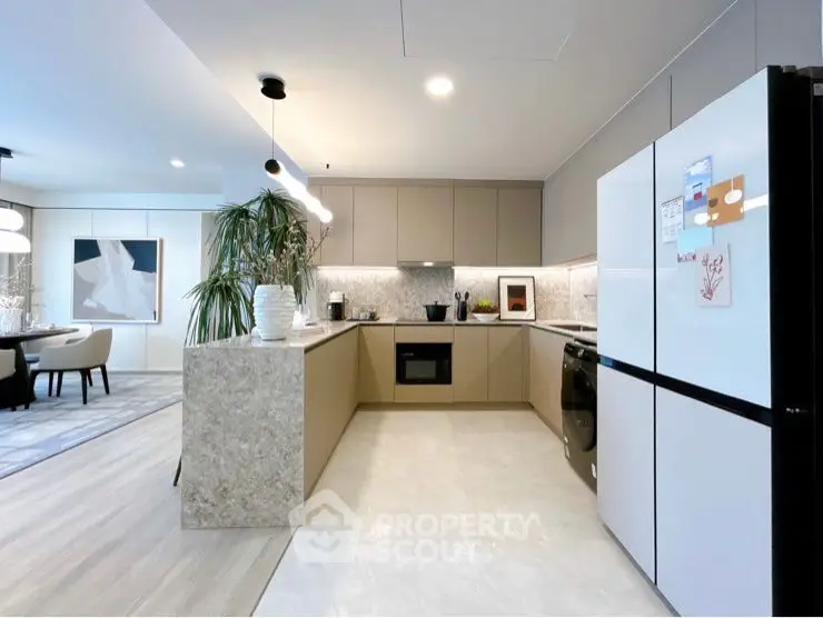 Modern kitchen with sleek design and open layout adjacent to dining area.