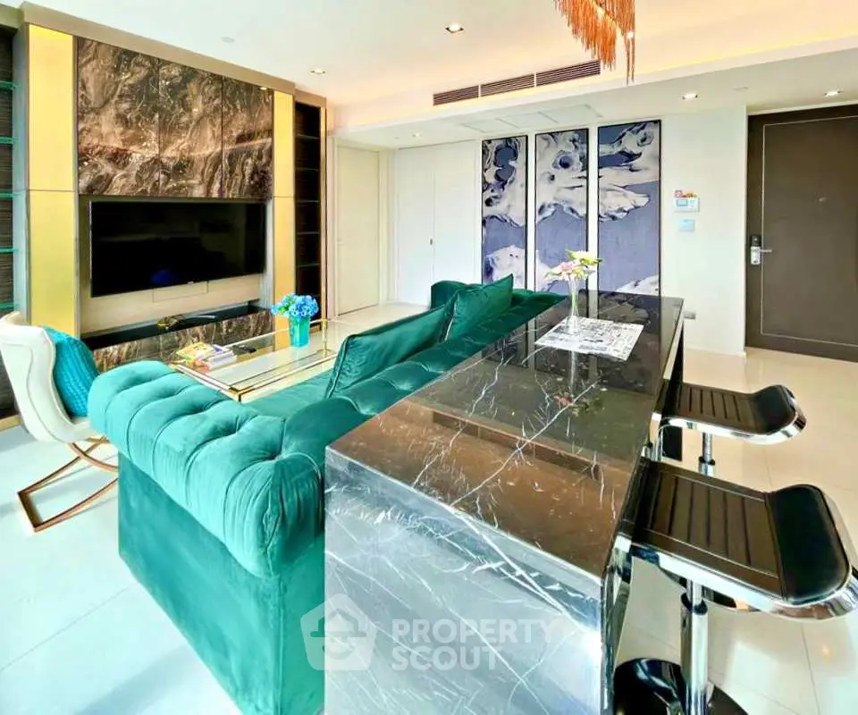 Luxurious modern living room with elegant green sofa and marble accents