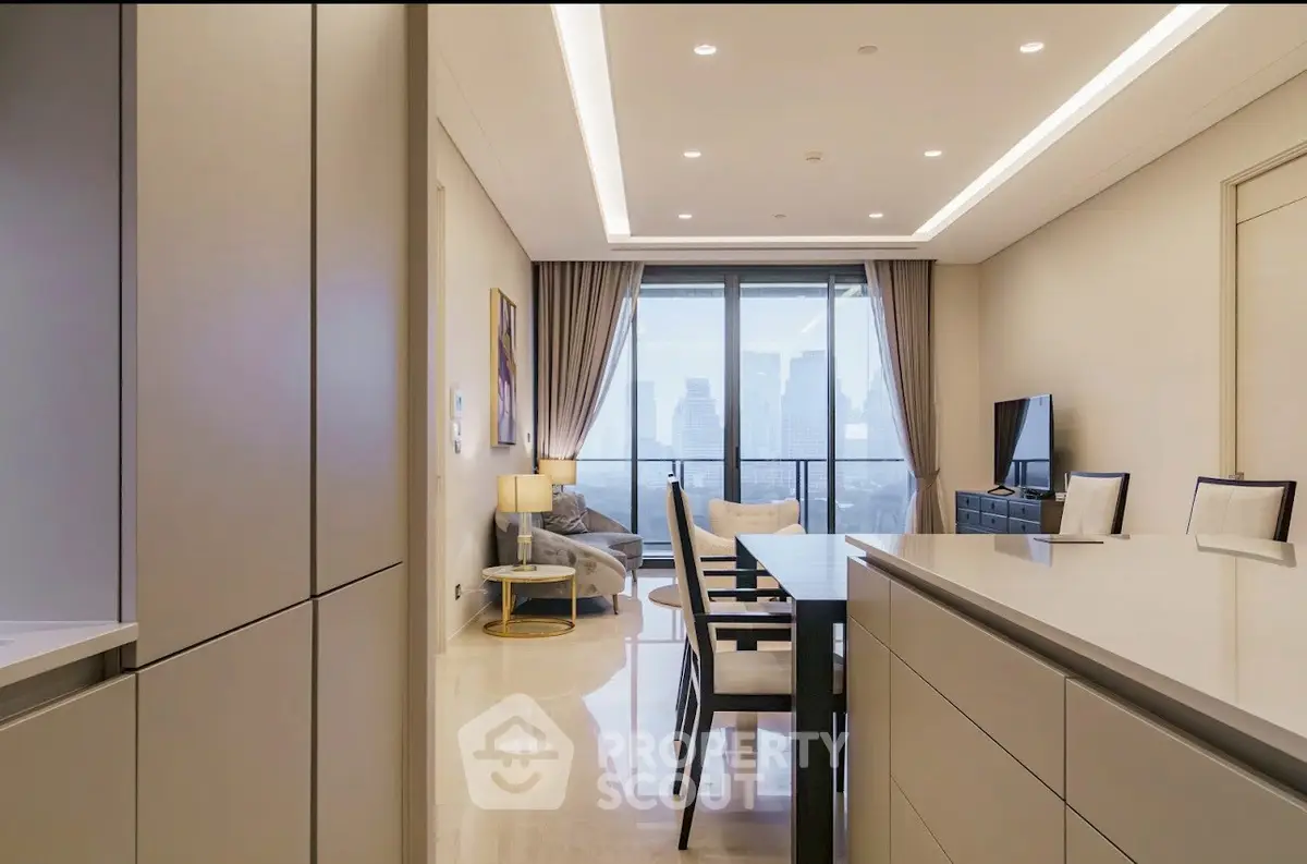 Luxurious modern living room with city view, elegant furniture, and open layout.