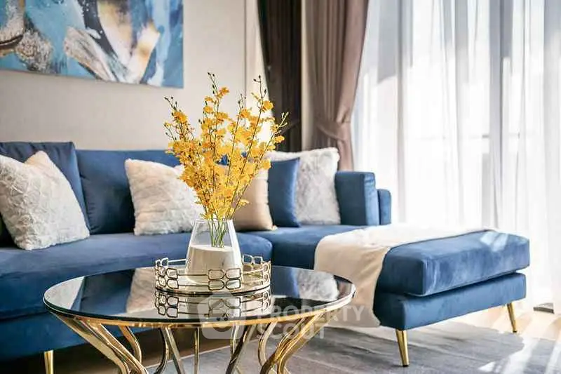 Luxurious living room with elegant blue sofa and chic decor