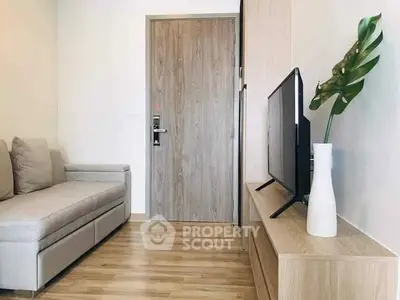 Modern living room with cozy sofa and sleek TV setup