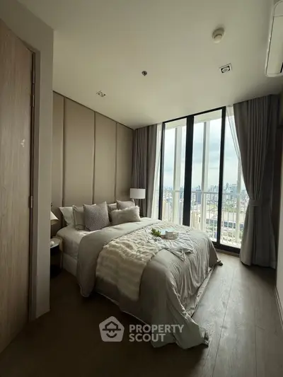 Luxurious bedroom with stunning city view and elegant decor