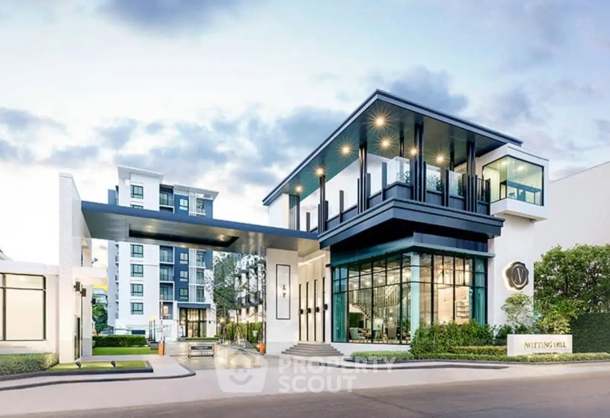 Modern luxury apartment building with sleek design and spacious balconies in urban setting.
