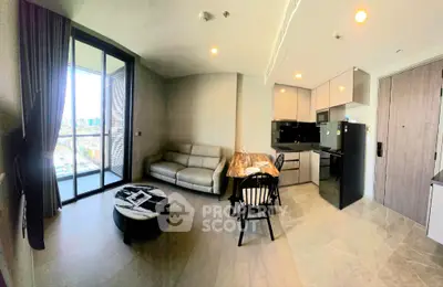 Modern open-layout living room with kitchen, featuring sleek furniture and city view balcony.