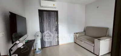 Modern living room with sleek furniture and air conditioning, perfect for comfortable living.