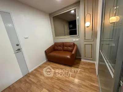 Cozy corner with leather sofa and elegant lighting in modern apartment