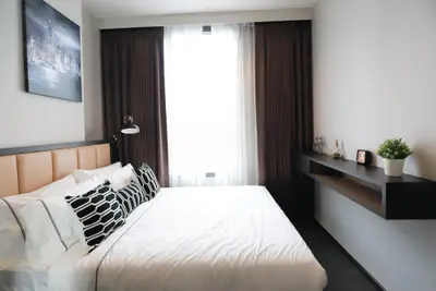 Modern bedroom with stylish decor and natural light