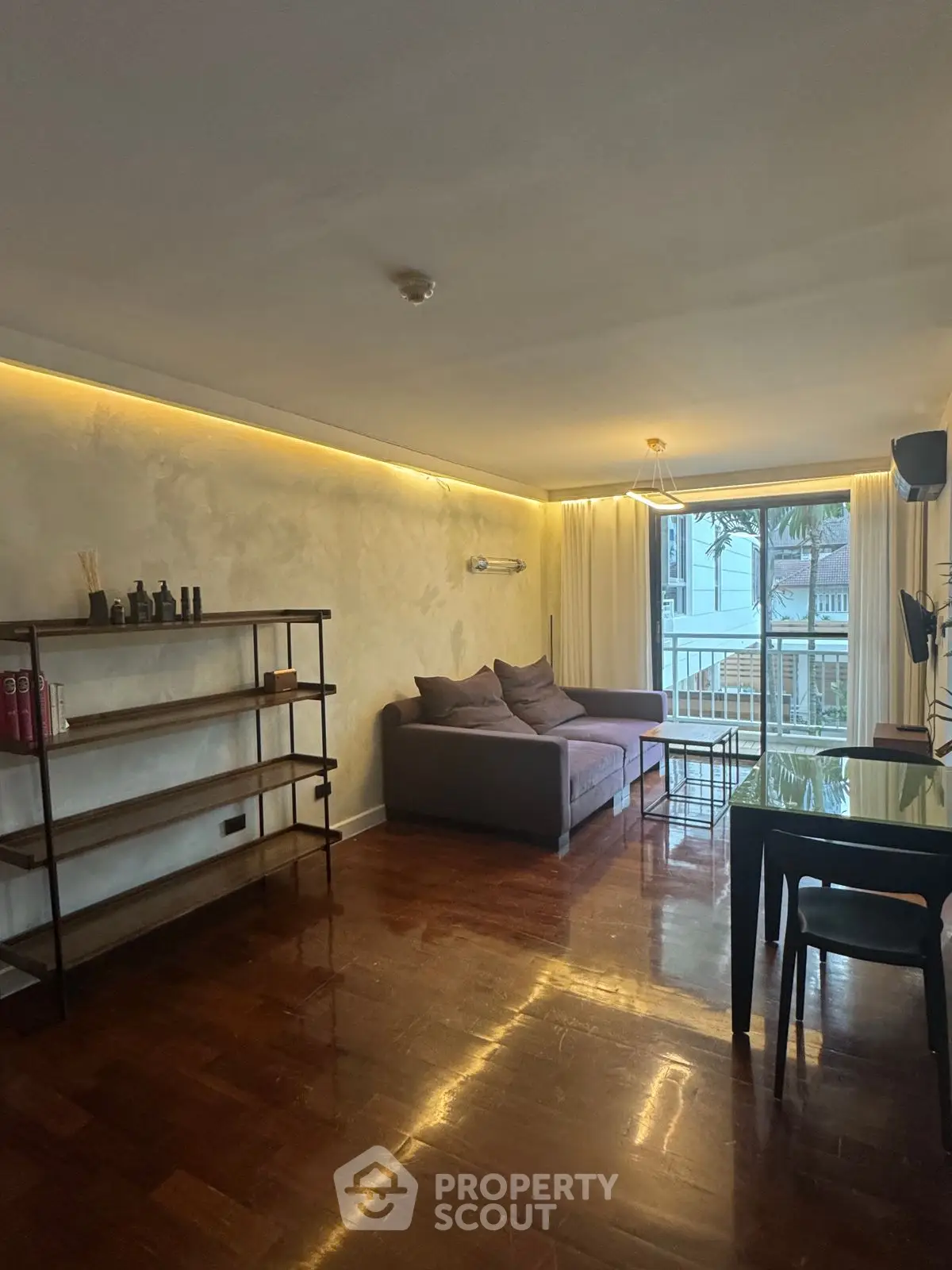 Stylish living room with modern decor and large windows offering natural light.