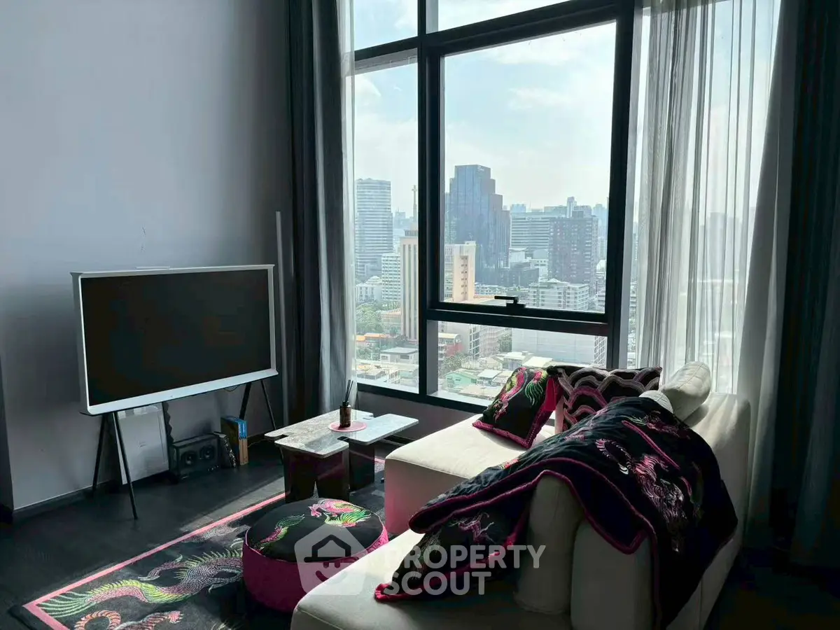 Modern living room with city view, stylish decor, and large windows.