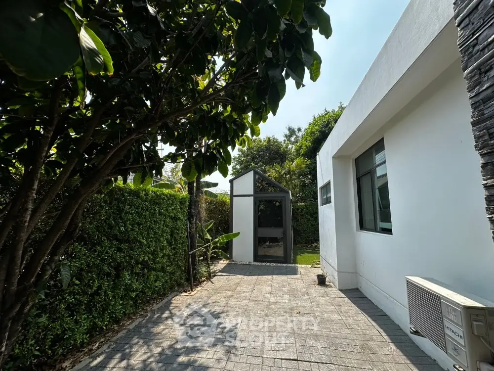 Charming garden view with modern exterior and lush greenery