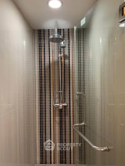Modern bathroom shower with sleek design and stylish tile accents