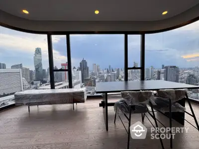 Stunning high-rise apartment with panoramic city skyline views and modern furnishings.