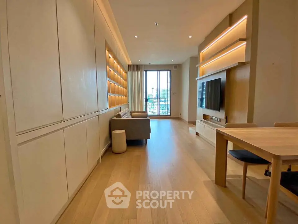 Spacious modern living room with wooden flooring and large windows
