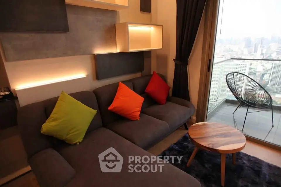 Modern living room with vibrant cushions and city view balcony